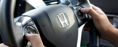 Photo of hands on a steering wheel at the 9 and 3 o'clock position